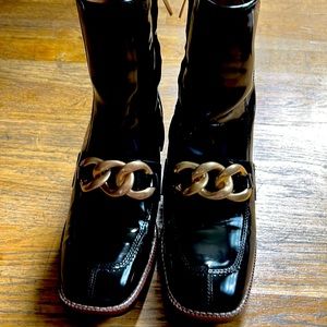 Steve Madden ankle boots with chain detail and stacked heels.